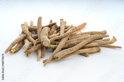 Ashwagandha, Withania Somnifera Root Closeup  over isolated background Top view