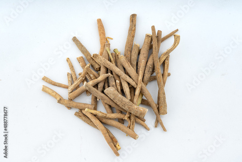Ashwagandha, Withania Somnifera Root Closeup  over isolated background Top view