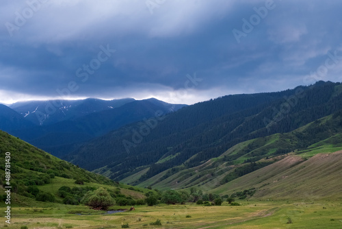 Beautiful mountains with heavy clouds. Thunderstorm, bad weather in the mountains concept. Gorge near Saty village.