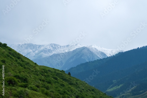 Beautiful mountains with heavy clouds. Thunderstorm, bad weather in the mountains concept. Gorge near Saty village. © Adil