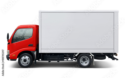 Small modern delivery truck with red cab and white box body. Side view isolated on white background.