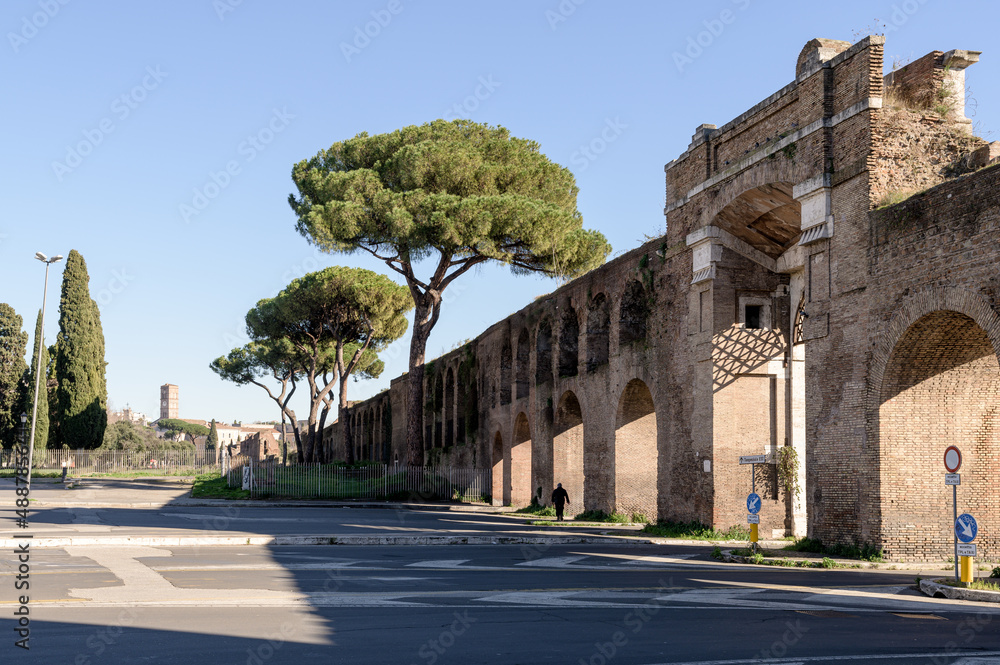 Porta San Giovanni, or Saint John gate, a defensive city wall from ancient medieval times, now with arches crossing over a highway near Saint John in Lateran basilica, Rome, Italy