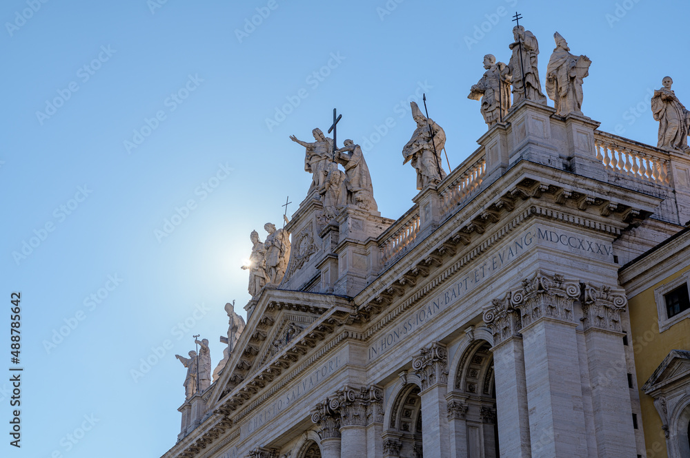 San Giovanni in Laterano facade, Rome, Italy. Detail of the sculpted statues of Jesus Christ and Apostles on top of Saint John in Lateran basilica, a main catholic church in Rome, Italy
