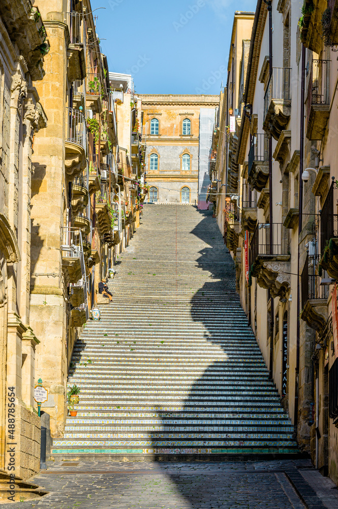 Staircase decorated with ceramics, Caltagirone, Italy. Vertical view of the famous Scala Santa Maria del Monte, a long public staircase in the hilltop medieval town of Caltagirone, famous for decorate