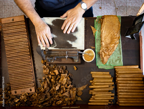 Hand made production of cigars from dried tobacco leaves, Garachico, Tenerife, Canary islands, Spain photo