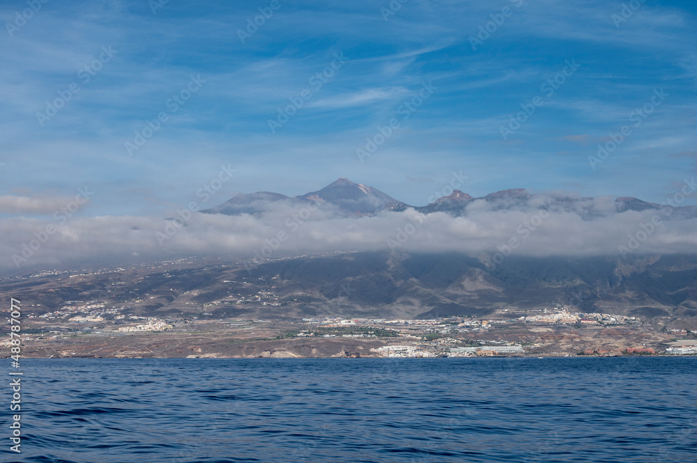 View on resorts and beaches of South coast of Tenerife island during sail boat trip along coastline, Canary islands, Spain