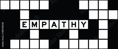 Alphabet letter in word empathy on crossword puzzle background