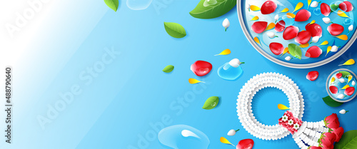 Thai traditional new year with jasmine garland and water in bowl (Use for Pouring water on hands of revered elders and ask for blessing in Songkran festival).
