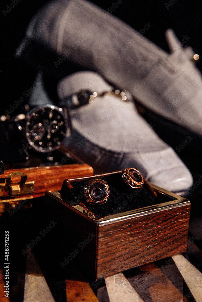 Wedding rings on the table. Wedding details for the ceremony. Wedding accessories. Close-up. Wedding rings on the table. Wedding details for the ceremony. Wedding accessories. Close-up.