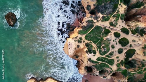 Cliffs on Sao Rafael beach by the Atlantic Ocean, Algarve, Portugal photo