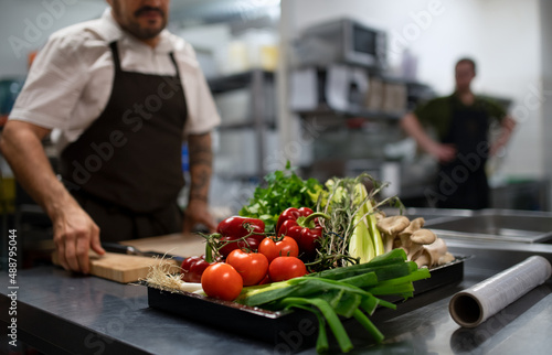 Slika na platnu Fresh ripe vegetables prepared for cutting in commercial kitchen.