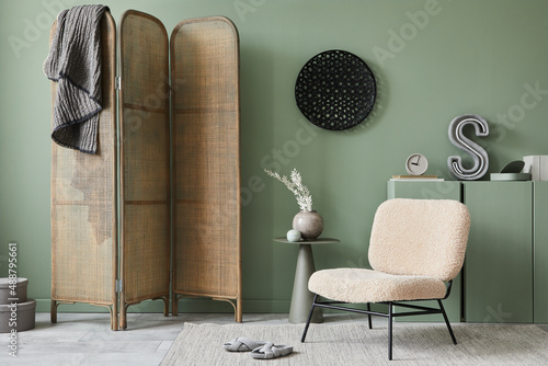 Εκτύπωση καμβά Creative living room interior composition with frotte armchair, folding screen, wooden commode and modern home accessories