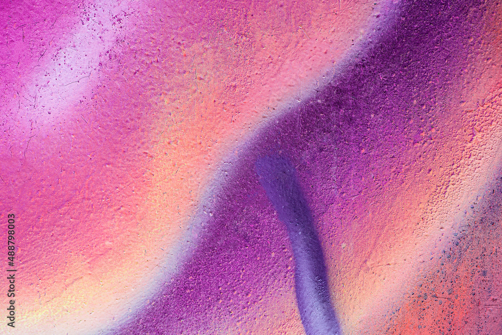 Obraz premium Beautiful bright colorful street art graffiti background. Abstract creative spray drawing fashion colors on the walls of the city. Urban Culture gradient texture, copyspace backdrop
