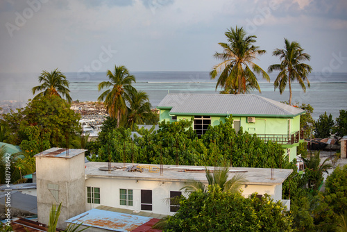 Aerial view of Gulhi island, houses and trees from above, Maldives