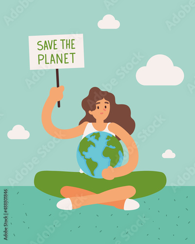 woman holds save the planet board