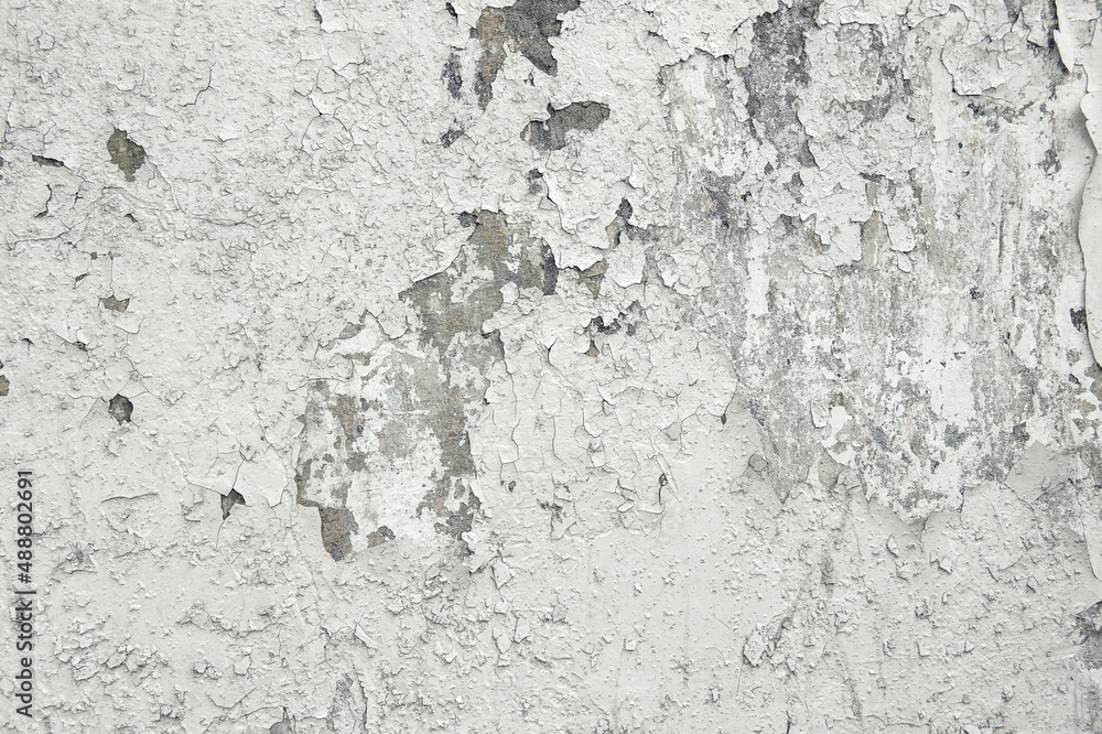 Cracked wall background. Cement white texture cracks