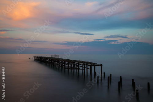 Beautiful dramatic sunset over the old bridge by the sea in Balchik  Bulgaria  Eastern Europe - dawn  dusk