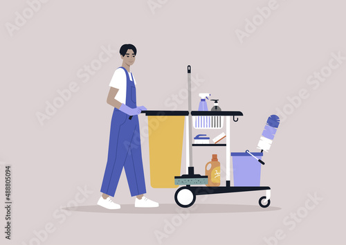 A young male Asian character in a uniform rolling a hotel cleaning service cart