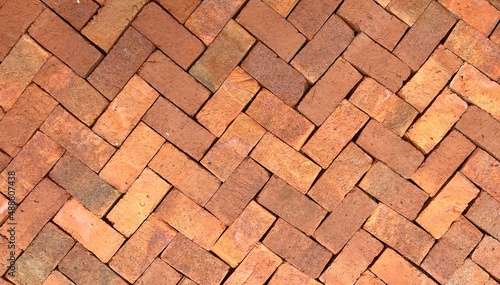 pattern background with brick wall or bricks floor pavement in garden.