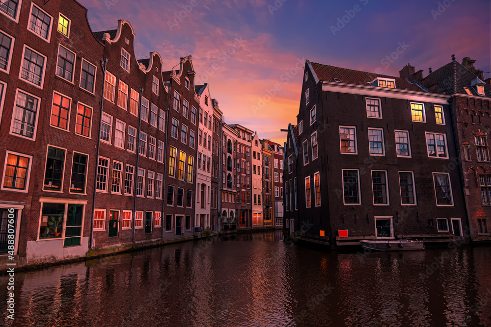 Traditional houses in the city center from Amsterdam in the Netherlands at sunset