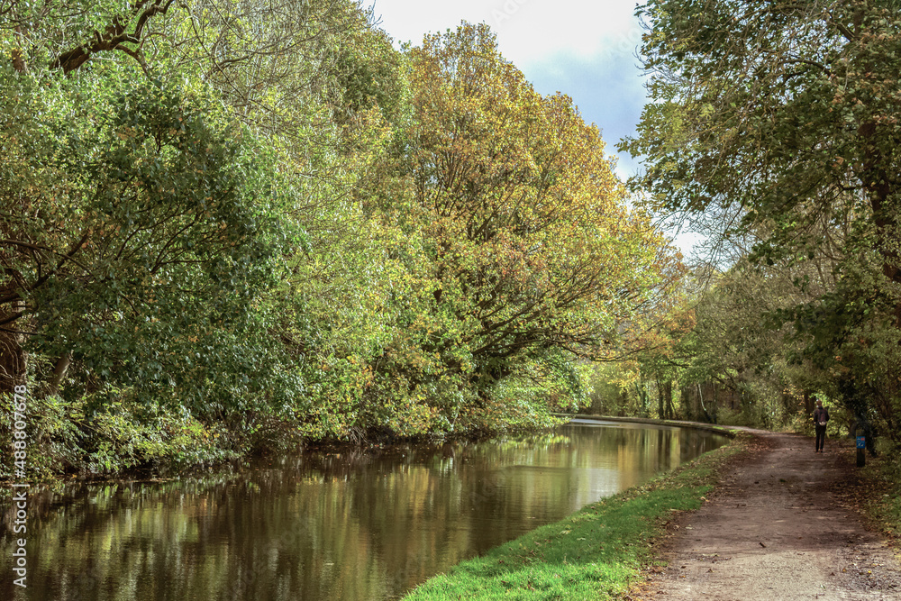 A peaceful scene along the tow path of the Leeds and Liverpool Canal between Bingley and Shipley is an ideal spot to take a relaxing stroll and enjoy the reflections in the gently moving water