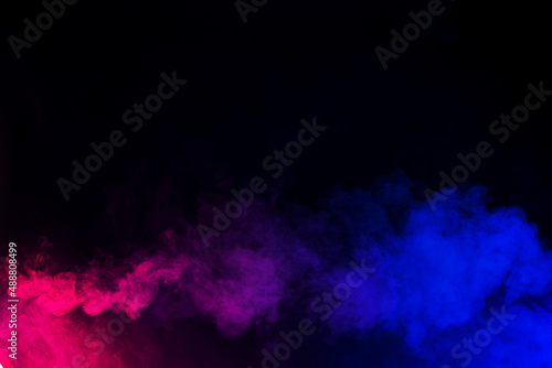 Panoramic view of the abstract neon fog. Colourful cloudiness  mist or smog moves on black background. Beautiful swirling smoke. Mockup for your logo. Wide angle horizontal wallpaper or web banner.
