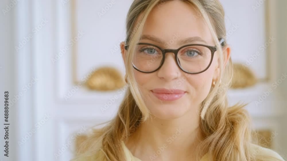 Portrait of happy smiling young attractive caucasian woman in eyeglasses looking on camera. Portrait of happy smiling young attractive caucasian woman in eyeglasses looking on camera.