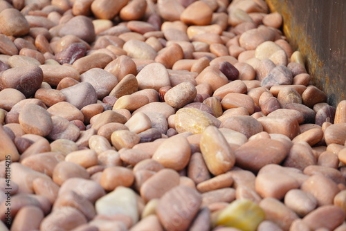 Plenty of brown Small Pebble Stones for wallpeper photo