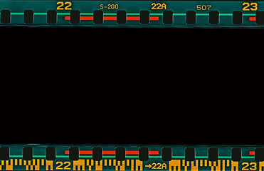 Film scan. Digital number and bezel on film photographs scanned. 35mm film frames strip scanned with signs of usage on bezel. blank old film strip frame background. Retro films border with numbers.