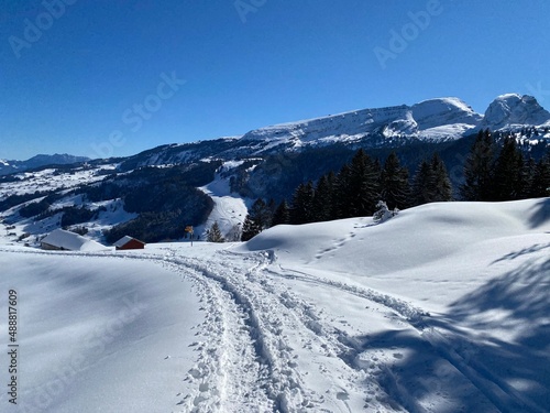 Wonderful winter hiking trails and traces on the slopes of the Alpstein mountain range and in the fresh alpine snow cover of the Swiss Alps - Alt St. Johann, Switzerland (Schweiz) © Mario