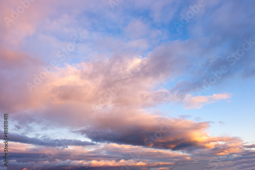 Beautiful dramatic sky at sunset or dawn with dark blue clouds and pink lighting © olmax1975