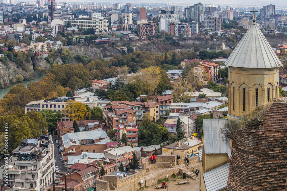 Fototapeta premium Aerial view of Old Tbilisi from Narikala Fortes. Sunny day in Tbilisi, Georgia