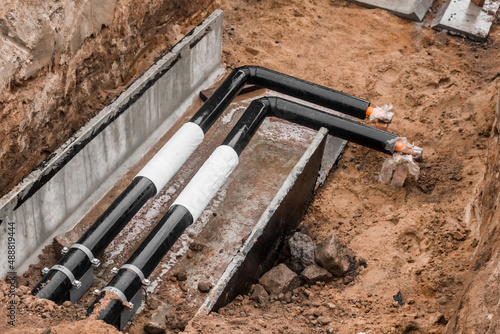 Repair of the water line of the heating main pipe in the ground trench pipeline at the construction site work industry