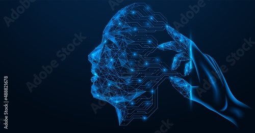The process of programming artificial intelligence. Transformation of the hand into a control tool. The printed circuit board forms the contour of a person's face. Mind control. Polygonal design.