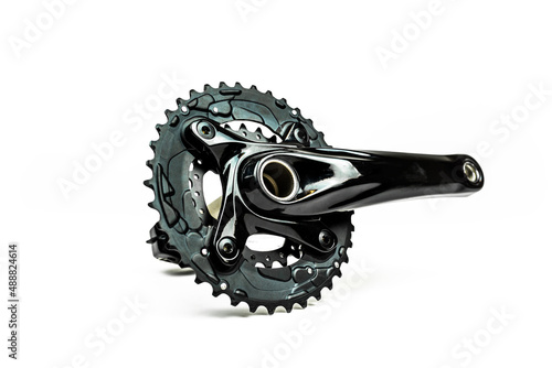 black chainring and crank on white background. bicycle gear photo