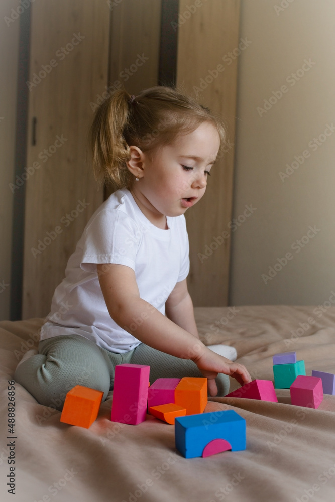 little girl plays with a soft children's constructor little girl plays with a soft children's constructor
