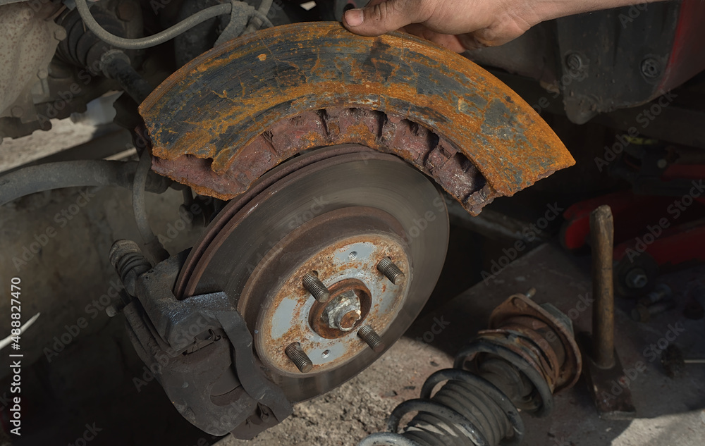 A car brake disc compared to an overheated and ruptured piece of a truck brake disc. A car brake disc compared to an overheated and ruptured piece of a truck brake disc.