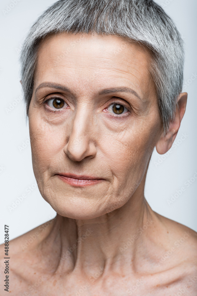 Obraz premium close up of middle aged woman isolated on grey