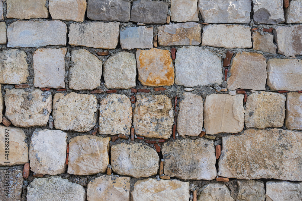 The texture of the stone wall. Background texture of the stone wall of the old castle. The texture of the stone wall. Background texture of the stone wall of the old castle.