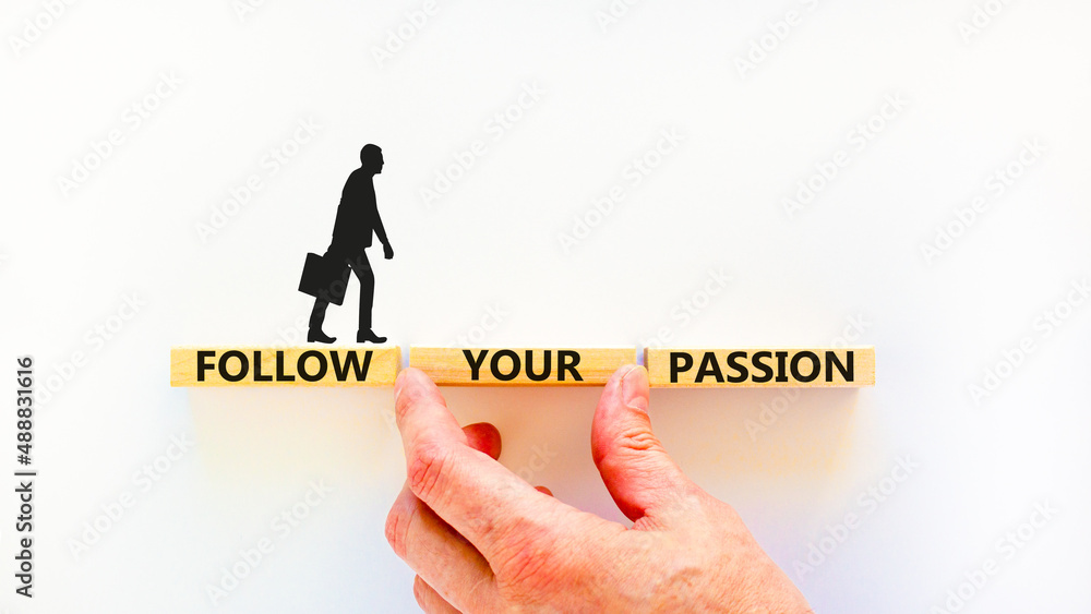 Follow your passion symbol. Concept words Follow your passion on blocks on beautiful white table white background. Businessman hand. Business, motivation and follow your passion concept. Copy space. Follow your passion symbol. Concept words Follow your passion on blocks on beautiful white table white background. Businessman hand. Business, motivation and follow your passion concept. Copy space.