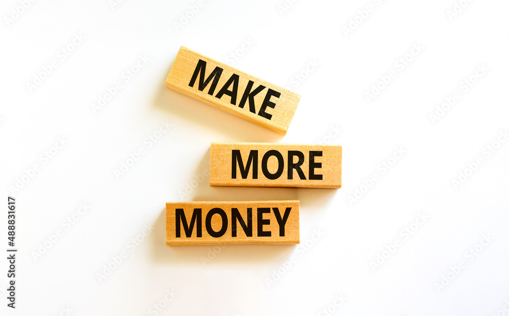 Make more money symbol. Concept words Make more money on blocks on beautiful white table white background. Business and make more money concept. Copy space. Make more money symbol. Concept words Make more money on blocks on beautiful white table white background. Business and make more money concept. Copy space.