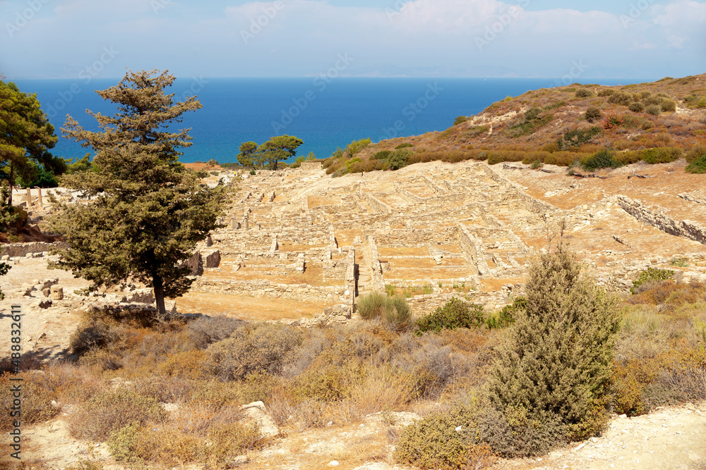 Ruins of Hellenistic houses and doric temple in ancient Kamiros archeological site Rhodes Greece