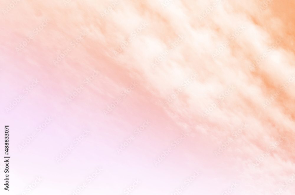 Orange sky with Soft clouds. Fantasy magical sunny sky pastel background is fluffy white cloud. Freedom wallpaper concept. Sweet color dream. 
