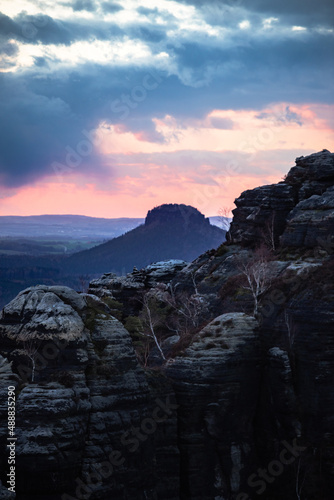 Schrammsteine at sunset from the viewing platform. Schrammsteine Mountains in Elbe Sandstone Mountains in Saxon Switzerland, Germany.