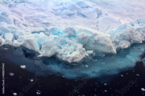 Glaciology. A hummock (toross) in the Arctic Ocean. Pay attention to the massiveness of the underwater part photo