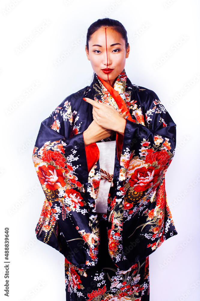 young pretty geisha in black kimono posing isolated on white background, asian ethno young pretty geisha in black kimono posing isolated on white background, asian ethno