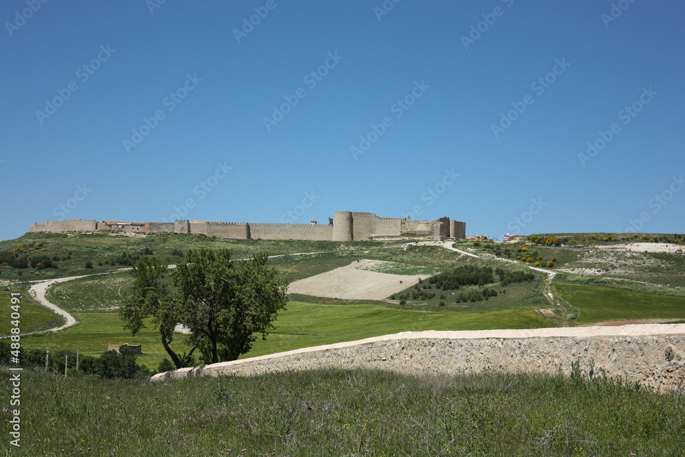 Walled city of Urueña on the top of a hill in Spain on a sunny spring day