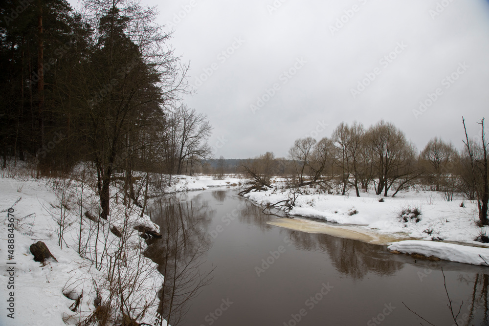 Spring landscape. River in early spring. Thaw. It's a nasty day Spring landscape. River in early spring. Thaw. It's a nasty day