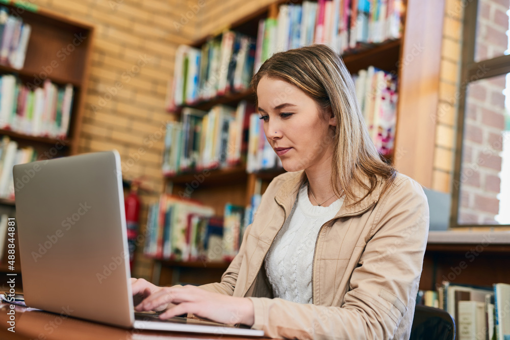 I always go straight to the internet to do research. Cropped shot of a university student doing some research on a laptop. I always go straight to the internet to do research. Cropped shot of a university student doing some research on a laptop.