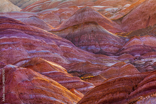 Sunrise over the colorful eroded badlands in the Zhangye Danxia National Geopark, Gansu Province, China
 photo